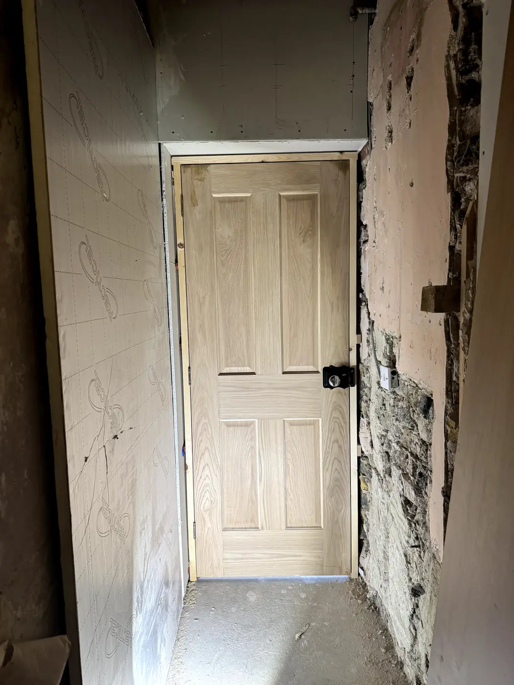 New oak panel door fitted in a hallway