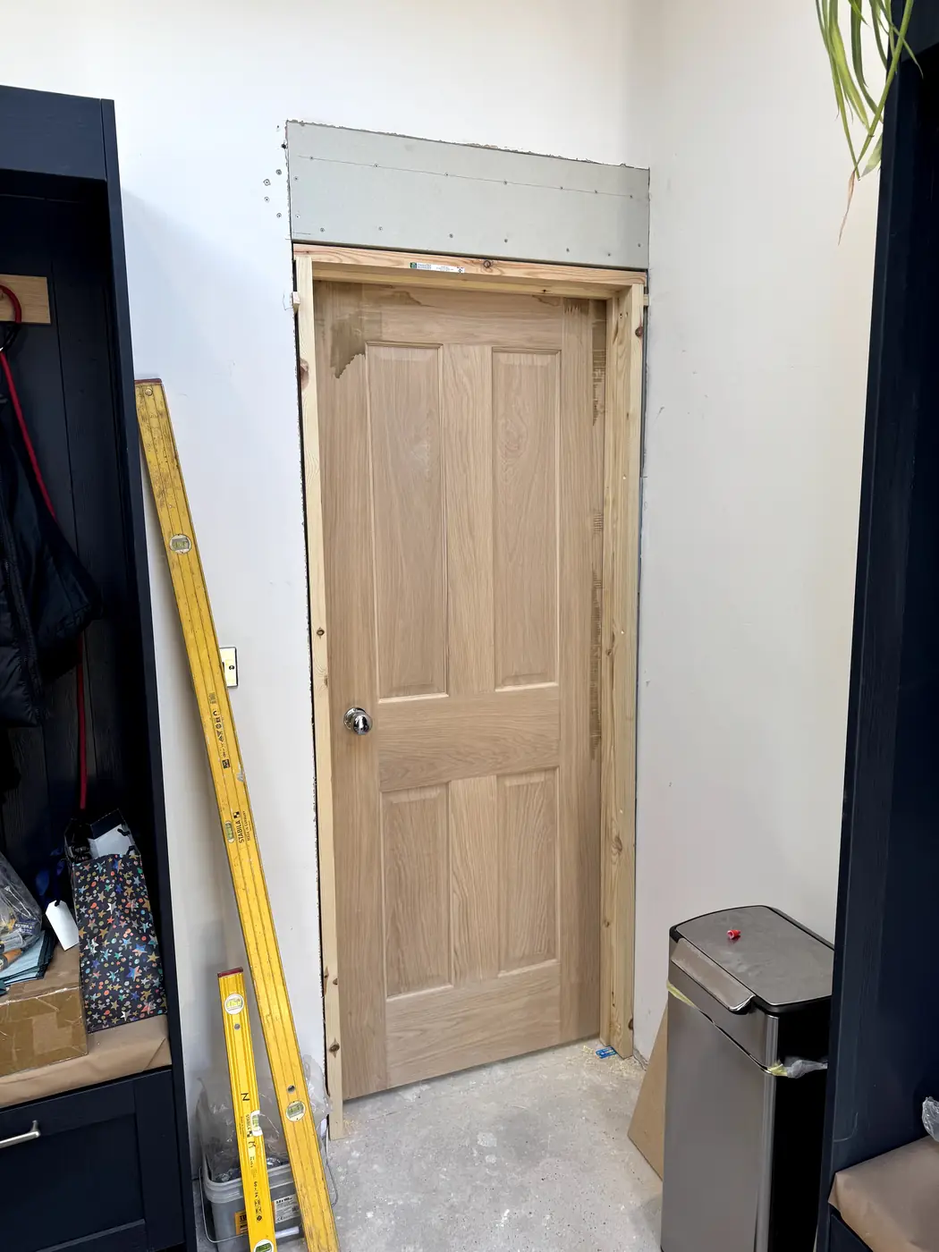 New oak panel door fitted, close view with ironmongery