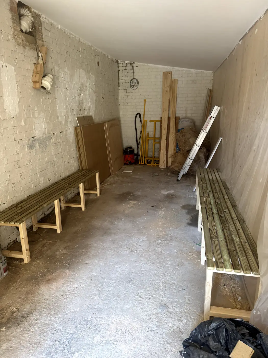 Storage room with timber benches, wider view
